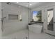 Modern bathroom with a soaking tub, glass-enclosed shower, and natural light at 10685 E Cinnabar Ave, Scottsdale, AZ 85258