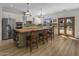 Spacious kitchen featuring an island with butcher block countertop and stainless steel appliances at 10685 E Cinnabar Ave, Scottsdale, AZ 85258