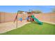 Backyard playground with artificial turf and gravel at 11004 N 154Th Ln, Surprise, AZ 85379