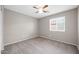 Bright bedroom with ceiling fan and carpet at 11004 N 154Th Ln, Surprise, AZ 85379