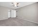 Spacious bedroom with ceiling fan and closet at 11004 N 154Th Ln, Surprise, AZ 85379