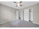 Bedroom with ceiling fan and double door closet at 11004 N 154Th Ln, Surprise, AZ 85379