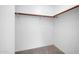 Spacious walk-in closet with wood shelving at 11004 N 154Th Ln, Surprise, AZ 85379