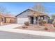 Single-story house with gray exterior, attached garage, and front yard landscaping at 11004 N 154Th Ln, Surprise, AZ 85379