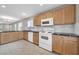 Modern kitchen with granite countertops and wood cabinets at 11004 N 154Th Ln, Surprise, AZ 85379