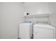 Laundry room with washer, dryer, and shelving at 11004 N 154Th Ln, Surprise, AZ 85379