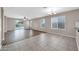 Living room features tile and vinyl plank flooring, and view to backyard at 11004 N 154Th Ln, Surprise, AZ 85379