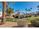 This desert community features lush green landscaping with mature trees and bushes at 11129 N 109Th St, Scottsdale, AZ 85259