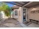 A charming front entrance with an adjacent courtyard area and desert landscaping at 11129 N 109Th St, Scottsdale, AZ 85259