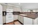 Kitchen with white appliances, granite countertops, and ample cabinet space at 11129 N 109Th St, Scottsdale, AZ 85259