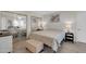 Main bedroom with tiled floor, mirrored closet doors, and a sitting area with ottoman at 11129 N 109Th St, Scottsdale, AZ 85259