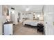 Main bedroom with tiled floor, mirrored closet doors, and a ceiling fan at 11129 N 109Th St, Scottsdale, AZ 85259