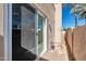 This private outdoor patio has a sliding glass door with a decorative stone surface at 11129 N 109Th St, Scottsdale, AZ 85259