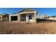 Unfinished home exterior with exposed framing and roofing at 11438 E Utopia Ave, Mesa, AZ 85212