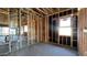 Unfinished interior with exposed framing and wiring at 11438 E Utopia Ave, Mesa, AZ 85212