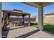 Private backyard oasis with covered patio and artificial turf at 13184 N 144Th Ln, Surprise, AZ 85379