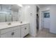 Bathroom with double vanity, large mirror, and walk-in shower at 13184 N 144Th Ln, Surprise, AZ 85379