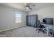 Bright bedroom with a standing desk and large window at 13184 N 144Th Ln, Surprise, AZ 85379