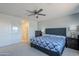 Main bedroom with king bed, ensuite access, and dresser at 13184 N 144Th Ln, Surprise, AZ 85379