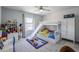 Bright bedroom with bunk beds, built-in slide, and ample storage at 13184 N 144Th Ln, Surprise, AZ 85379