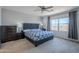 Spacious bedroom with large bed, nightstands and window at 13184 N 144Th Ln, Surprise, AZ 85379