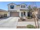 Two-story house with a brown garage door and landscaped yard at 13184 N 144Th Ln, Surprise, AZ 85379