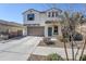 Two-story house with a brown garage door and landscaped yard at 13184 N 144Th Ln, Surprise, AZ 85379