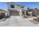 Two-story house with a brown garage door and landscaped yard at 13184 N 144Th Ln, Surprise, AZ 85379