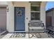 Gray front door accented by a wreath and welcome mat at 13184 N 144Th Ln, Surprise, AZ 85379