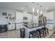 Spacious kitchen featuring white cabinets, granite countertops, and an island at 13184 N 144Th Ln, Surprise, AZ 85379