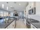 Modern kitchen featuring granite countertops and stainless steel appliances at 13184 N 144Th Ln, Surprise, AZ 85379