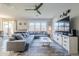 Relaxing living room, featuring a sectional sofa and a large TV at 13184 N 144Th Ln, Surprise, AZ 85379