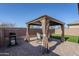 Patio with gazebo, table, chairs, and grill at 13184 N 144Th Ln, Surprise, AZ 85379