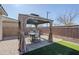 Covered patio features a dining table and chairs for outdoor entertaining at 13184 N 144Th Ln, Surprise, AZ 85379