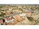 Aerial view showcasing a residential neighborhood with golf course views at 13917 W Pavillion Dr, Sun City West, AZ 85375