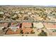 Aerial view of a residential area featuring multiple homes and a street at 13917 W Pavillion Dr, Sun City West, AZ 85375