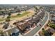 Aerial view of a house in a neighborhood adjacent to a golf course at 13917 W Pavillion Dr, Sun City West, AZ 85375