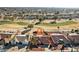 Aerial view of a single-story home with a landscaped yard and golf course views at 13917 W Pavillion Dr, Sun City West, AZ 85375