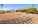 View of the back of the house and the backyard at 13917 W Pavillion Dr, Sun City West, AZ 85375