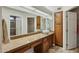 Bathroom with modern vanity and large mirror at 13917 W Pavillion Dr, Sun City West, AZ 85375