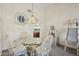 Dining area with glass-top table and wicker chairs at 13917 W Pavillion Dr, Sun City West, AZ 85375