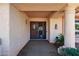 Front entry with double doors, security screen, and terracotta tile flooring at 13917 W Pavillion Dr, Sun City West, AZ 85375