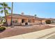 Single-story home with tile roof, desert landscaping, and a two-car garage at 13917 W Pavillion Dr, Sun City West, AZ 85375