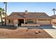 Single-story home with tile roof and desert landscaping at 13917 W Pavillion Dr, Sun City West, AZ 85375