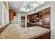 Kitchen features tile countertops, wood cabinets and breakfast bar at 13917 W Pavillion Dr, Sun City West, AZ 85375