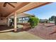 Covered patio with seating area and view of the backyard at 13917 W Pavillion Dr, Sun City West, AZ 85375