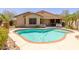 Inviting kidney-shaped pool with brick coping in a sunny backyard at 14960 W Cottonwood St, Surprise, AZ 85374