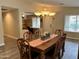 Dining room with hardwood floors and a chandelier at 14960 W Cottonwood St, Surprise, AZ 85374