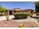 Single-story home with landscaped front yard and two-car garage at 14960 W Cottonwood St, Surprise, AZ 85374