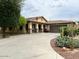 Single story home with driveway and desert landscaping at 14960 W Cottonwood St, Surprise, AZ 85374